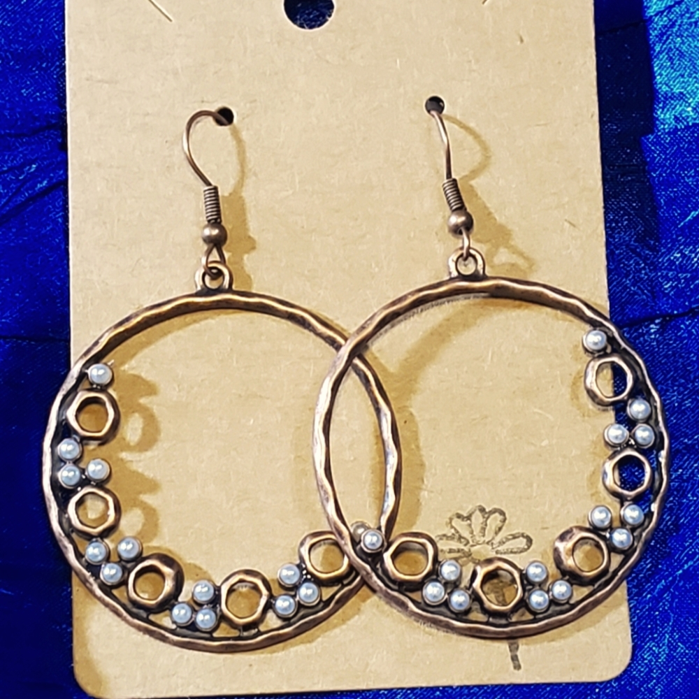 Circular copper earrings with small clustered beading